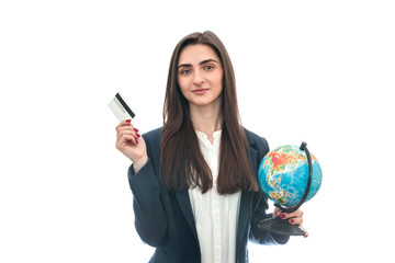 Woman with globe and credit card isolated on white