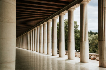 Greek architecture columns in a row. Ancient stone pillars.