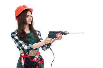 Young woman with drill isolated on white