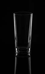 Empty high glass, isolated on a black background