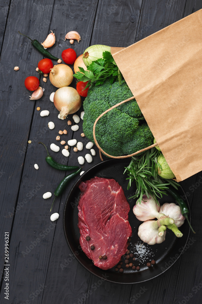 Poster Grocery bag top view with healthy food on a wooden background top view