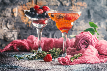 Fresh berry drink with blueberries, raspberries and seeds in margarita glasses