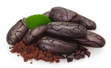 Cocoa bean with powder on white background