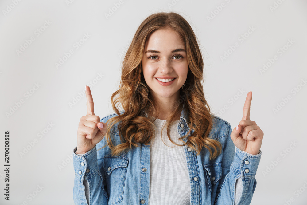 Canvas Prints Attractive young girl standing isolated over white