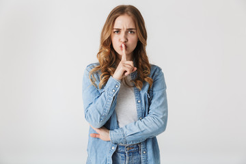 Attractive young girl standing isolated over white