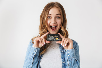 Attractive young girl standing isolated over white
