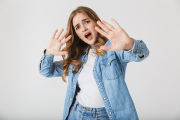 Attractive young girl standing isolated over white