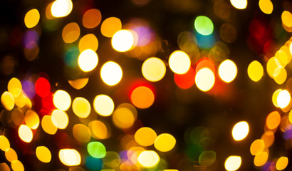 Christmas Eve, New Year decoration lights bokeh blurred background.