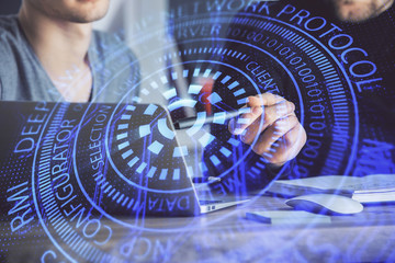 Multi exposure of data internet theme hologram with man working on computer on background. Concept of innovation.