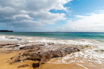 Panorama of beautiful beach and tropical sea of Lanzarote. Canaries