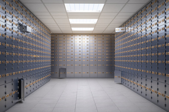 Safe deposit boxes room inside of a bank vault.