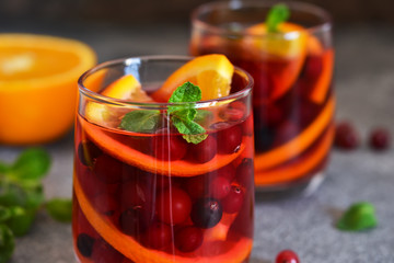 Hot cranberry tea with orange, mint and spices.