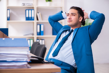 Young handsome businessman sitting in the office 