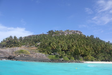 Fototapeta na wymiar private island beach seychelles palm coconut sand sun