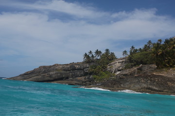 Fototapeta na wymiar private island beach seychelles palm coconut sand sun