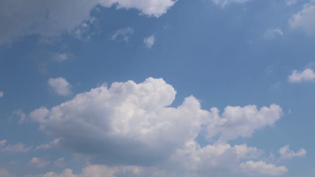Sunny white clouds, blue clear sky. White clouds running over blue sky. Timelapse Full HD, 1920x1080, 25FPS.