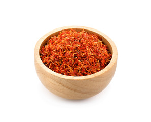 Safflower dried in wood bowl on white background