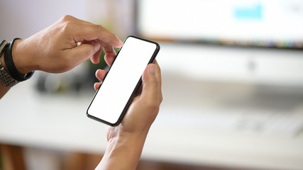 Man with mobile phone with isolate blank screen  in office