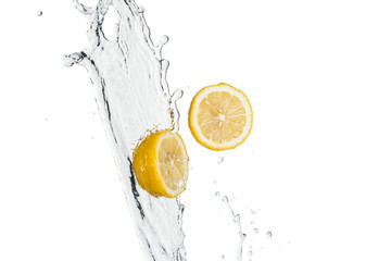 yellow fresh lemons with water splash and drops isolated on white