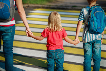 Mother with two kids going to school or daycare