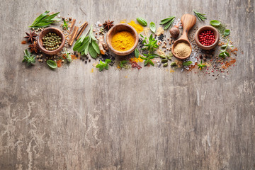 Herbs with spices on wooden board