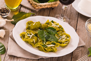 Spinach ravioli with ricotta cheese filling.