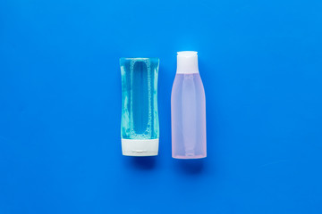 Organic cosmetics for face clearing with facial tonic and mycelial water on blue background top...