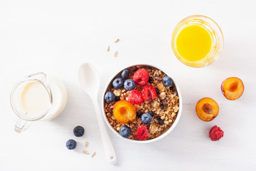healthy granola for breakfast with berry fruit nut, vegan milk