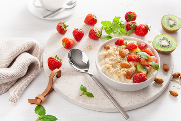 healthy breakfast oatmeal porridge, strawberry, nuts