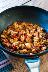 Manchurian Chicken with Soy Sauce, Julienne  Vegetables in Iron Wok Pan / Asian Style Cooking