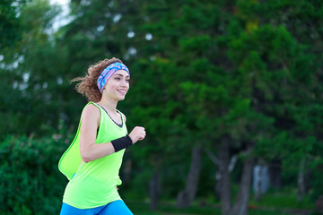 Running woman. Female Runner Jogging during Outdoor Workout in a Park. Beautiful fit Girl. Fitness...