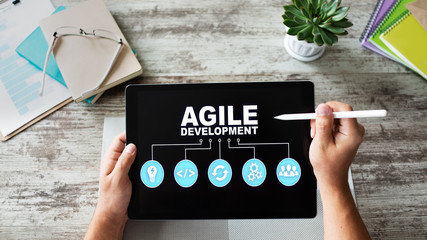 Agile development concept on the device screen.