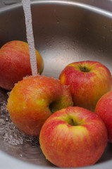 Washing the apples under the tap