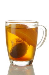 Fresh brewed tea with orange glass mug isolated on white