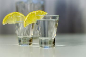 vodka in a glass with lemon