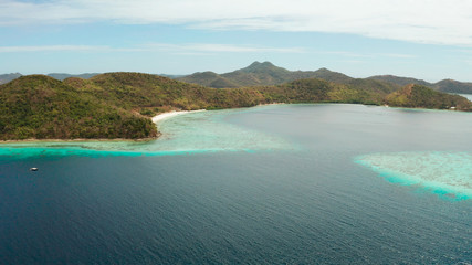Fototapeta premium group tropical islands with white sand beach and blue clear water. aerial view seascape Philippines Palawan, Bulalacao