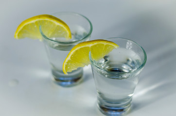 vodka in a glass with lemon