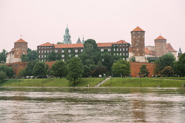 Scenic view at  Wawel castle in Cracow city (Krakow), Poland, from Vistula river (Wisla) quay in summer day.