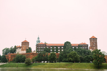 Fototapeta na wymiar Scenic view at Wawel castle in Cracow city (Krakow), Poland, from Vistula river (Wisla) quay in summer day.