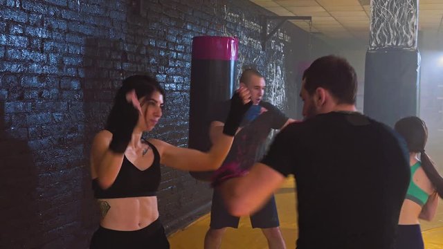 Women's self-defense class. A group of young women in the classroom in the gym for women's self-defense