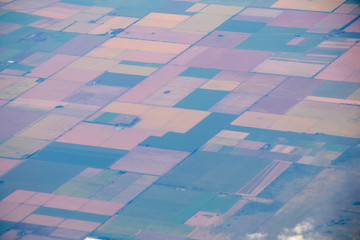 Aerial view of american countryside, farmland from the plane with green agriculture fields