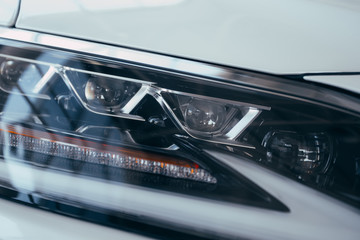 Fototapeta premium Close up detail on one of the LED headlights modern car.