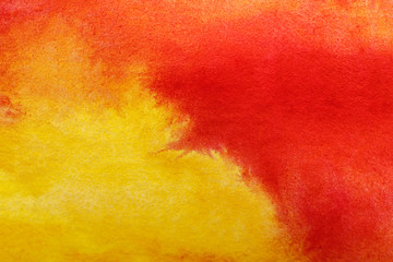 close up view of yellow and red watercolor mixed paints