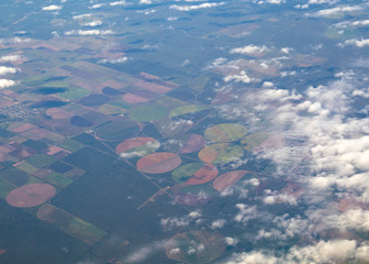 Aerial view of american countryside, farmland from the plane with green agriculture fields