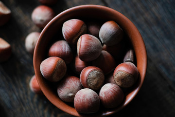 Hazelnut close up. Hazelnuts nuts on wooden background.
