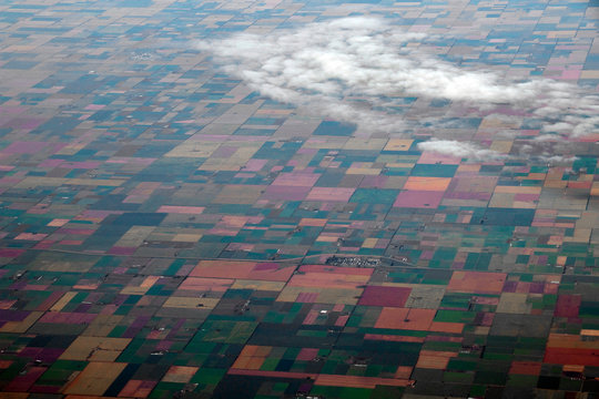 Aerial View Of American Countryside, Farmland From The Plane With Green Agriculture Fields