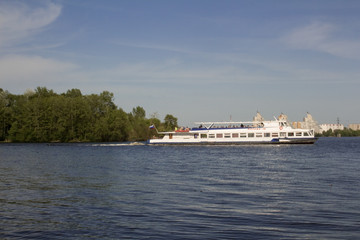 Fototapeta na wymiar Big yacht, the ship transports people along the wide river