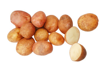 A lot of raw potatoes on a white isolated background