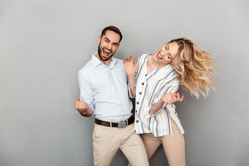 Fototapeta premium Photo closeup of cute couple in casual clothing smiling and dancing