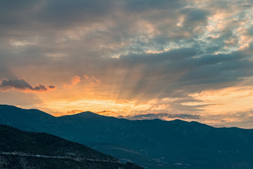 The sun rises over the mountains